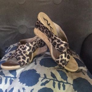 Metallic animal print wedge sandals.